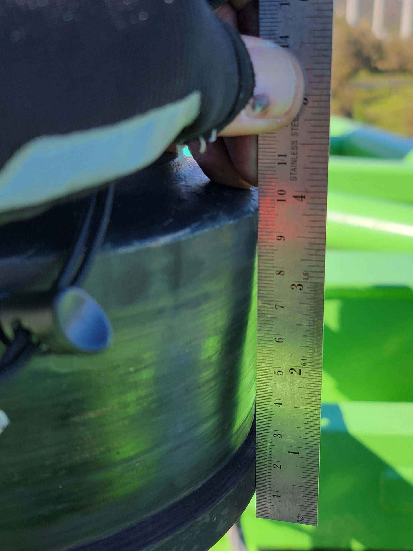 Aidaptive Consulting Engineer measuring an asset during inspection. offering an assest compliance program