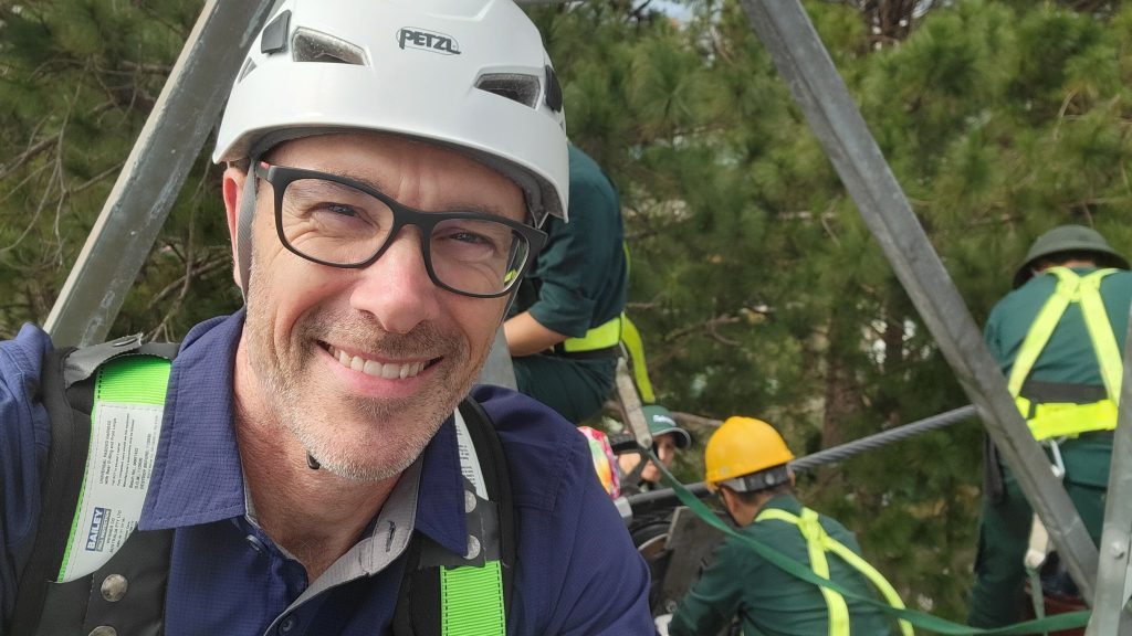 clinton ford, director of aidaptive consulting atop a flying fox